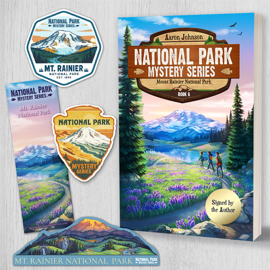 Book titled 'National Park Mystery Series' with Mt. Rainier and nature-themed illustrations on a white background with bookmark and stickers and signed copy of book